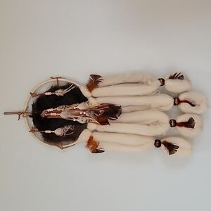 Dreamcatcher rabbit fur, feathers, beads, wool, and leather.  Wall hanging.